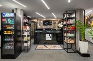 a store aisle with shelves of products in a store at Fashion City Hotel Superior in Budapest