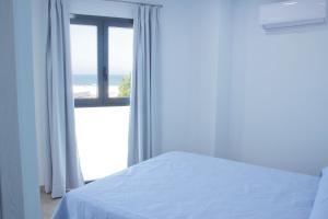 Postel nebo postele na pokoji v ubytování Hostal Brisas de Conil