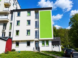 a building with a green face on the side of it at Bendorf Hotel by Belvilla in Bendorf