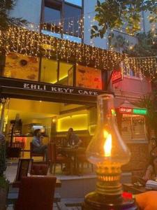 a building with christmas lights and a bottle on a table at Ehli Keyf Hotel in Istanbul