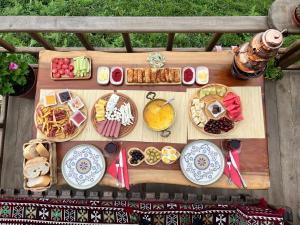 a table filled with different types of food on it at Himora Suit Bungalov in Ardeşen +78 photos