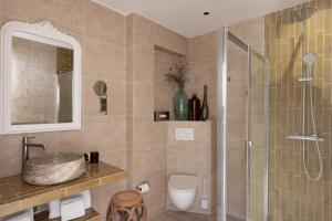 a bathroom with a shower and a sink and a toilet at Solemare in Bonifacio +54 photos