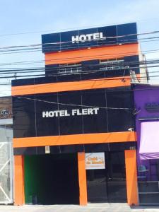 a hotel with a sign on the side of it at Hotel Flert Santana in Sao Paulo