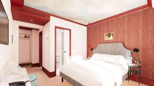 a bedroom with a white bed and a red wall at Grand Hôtel De Turin in Paris