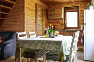 a dining room with a table and chairs at Przystanek Semlin - Za Jeziorem in Semlin +25 photos