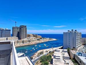 a view of a harbor with boats in the water at Zyra Hotel St Julians - Adults only in St. Julianʼs