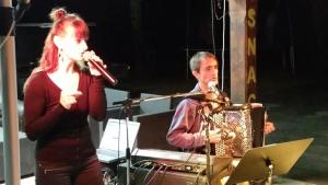 a man and a woman playing instruments on a stage at Camping 3 étoiles - Piscine - ccbgbeh in Puy-lʼÉvêque +20 photos