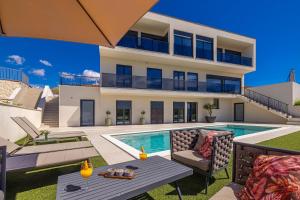 an image of a house with a swimming pool at Luxury apartment LaRiv II with pool in Krk