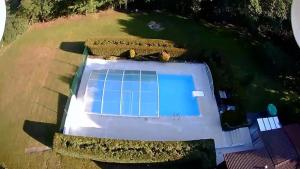 an overhead view of a swimming pool in a yard at Camping 3 étoiles - Piscine - ccbgaig in Loubeyrat +12 photos