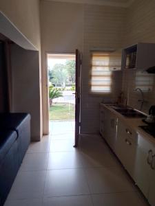 a kitchen with a door open to a yard at Hillview inn hotel in Serowe +16 photos