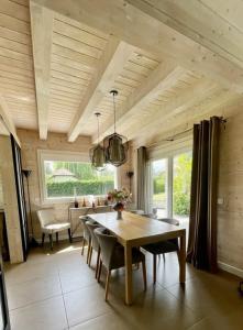 a dining room with a table and chairs at Modern chalet next to Geneva in Divonne-les-Bains