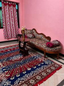 a living room with a couch and a table at CR Private Villa in Tiruvannāmalai