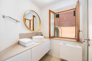 a bathroom with a sink and a mirror at Casa del Call in Palma de Mallorca +20 photos