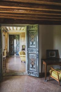 a room with a door with a painting on it at Villa Stecchini in Bassano del Grappa