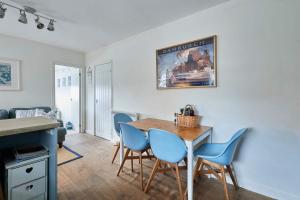 a kitchen and dining room with a table and chairs at The Bamburgh Bolthole in Bamburgh