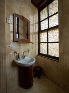 a bathroom with a sink and a mirror and a window at AKİFBEY KONAĞI in Kastamonu +100 photos