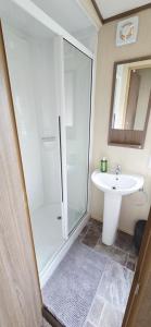 a bathroom with a shower and a sink at The Minver - Park Dean Resort in Saint Minver