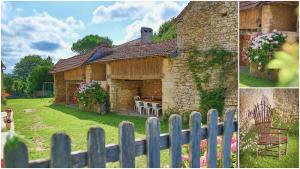 a stone house with a table in the yard at Gîte brisset in Coulaures