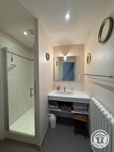 a bathroom with a sink and a shower at Gîte brisset in Coulaures +32 photos