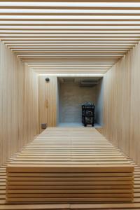 a room with a wooden floor and a wooden wall at SOSHIJI Arashiyama in Kyoto