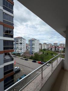 a balcony with a view of a street and buildings at LUXOR RESIDENCE in Trabzon