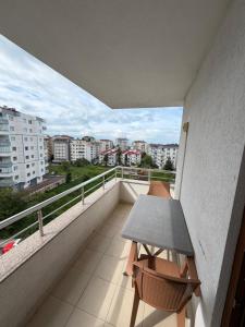 a balcony with a table and a view of a city at LUXOR RESIDENCE in Trabzon