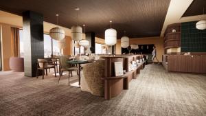 a lobby with a bar and tables and chairs at Fahrenheit Seven Les Menuires in Les Menuires