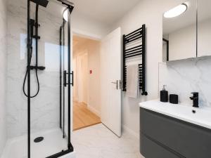 a bathroom with a shower and a sink at The Blackhorse Windsor in Dorney +13 photos