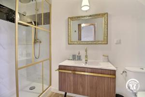 a bathroom with a sink and a shower at Le petit cottage in Ruffiac +31 photos