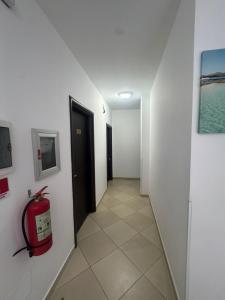 a hallway with a fire hydrant in a room at Villa Noah in Ksamil