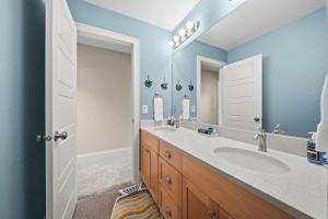 a bathroom with a sink and a mirror at Casa Roja in Edina +67 photos