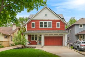 a red house with a red garage at Casa Roja in Edina