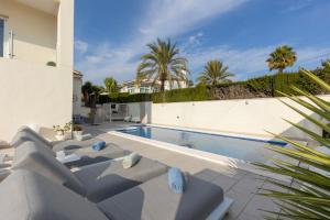 a swimming pool in the backyard of a house at Casa Karlsen in Ciudad Quesada