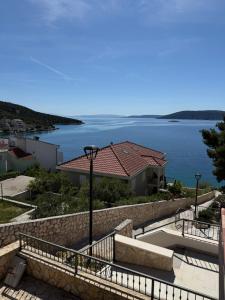 a house with a view of the water at Apartman Emilija in Vinišće