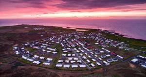 an aerial view of a parking lot next to the ocean at North Street Sandgerði in Sandgerði