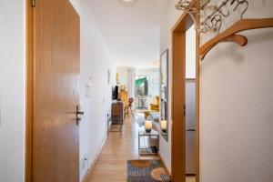 a hallway leading to a living room with a hallway at Haus Grete in Langenargen