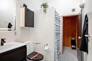 a white bathroom with a toilet and a sink at 746-Hvide-Sande-Slusen-46 in Hvide Sande +31 photos