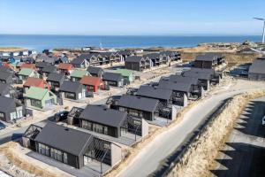 an aerial view of a row of houses near the ocean at 9952-Hvide-Sande-Langsand-204 in Hvide Sande