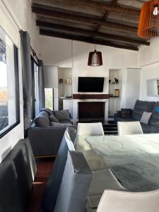 a living room with a couch and a table at Casa Estrella de Mar in La Paloma