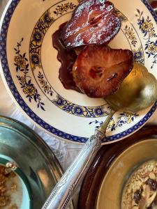a plate of food on a table with a spoon at La Cubanita in Kojsko
