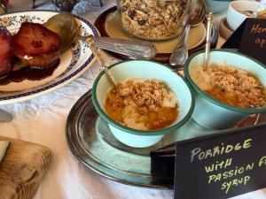 a table with bowls of food and plates of food at La Cubanita in Kojsko