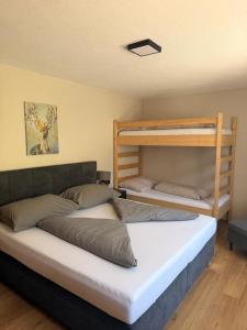 two bunk beds sitting in a room with at Waldhaus Talblick in Biberwier