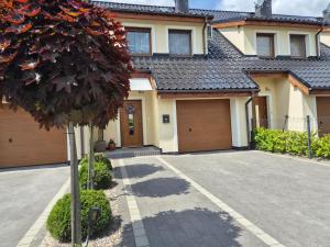 a house with a driveway in front of it at Lawendowa Home in Milicz