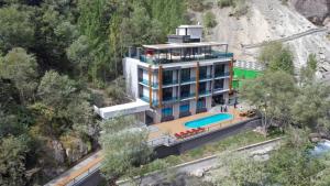 an aerial view of a building with a swimming pool at Chorchaman Hills in Patkunob