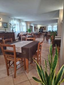 a dining room with a table and chairs at Agriturismo Palas De Serra Country Resort in Onifai