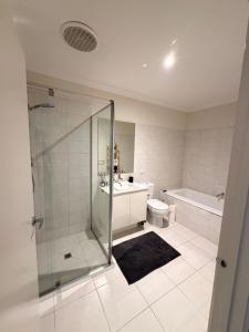 a bathroom with a shower and a toilet and a sink at Shared House in Melbourne in Bundoora +11 photos