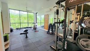 a gym with a bunch of equipment in a room at Villa Jaliza - Luxury 7 bedroom Villa, Chaweng, Samui in Chaweng Noi Beach