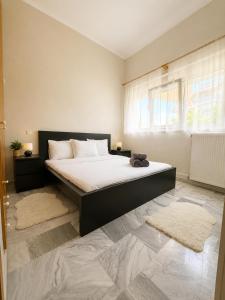 a bedroom with a large bed in a room at Asana by Agora Flats in Thessaloniki