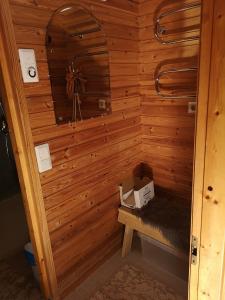 a sauna with a box in a wooden wall at Talvitahko 3 in Nilsiä +15 photos