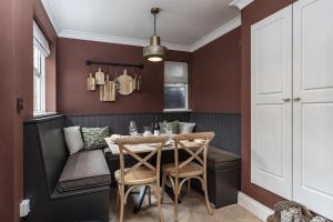 a dining room with a table and chairs at 2BR House By Cozy Quarters Property Management Holiday Lets Sedgefield With Open Field & Countryside Views in Sedgefield +30 photos